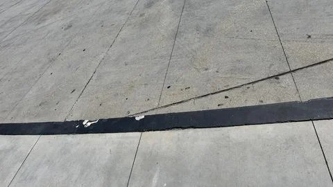 Abstract texture, concrete surface with a dark curved seam 写真素材