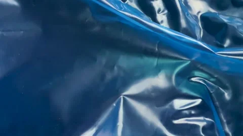 Abstract texture of crumpled blue plastic material Stock Footage 340580972
