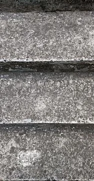 Abstract texture of dark grey weathered concrete steps with stone steps Stock Photos