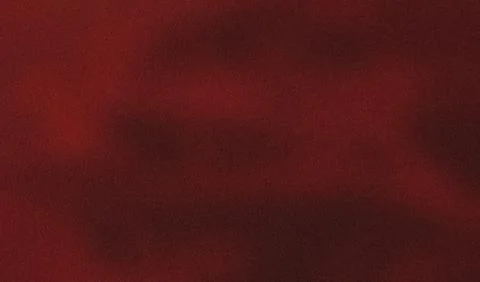 Abstract texture is formed by a grainy red gradient background 스톡 사진