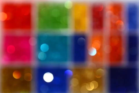 Abstract texture with multicolored bokeh. Colored squares. Blurring backgroun Stock Photos