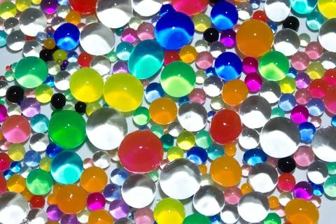 Abstract texture with multicolored transparent decorative gel balls. Hydrog.. Stock Photos