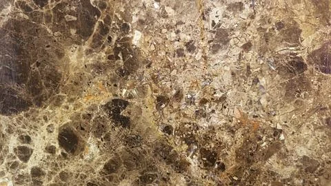 Abstract texture of polished brown and gold marble stone Stock Photos