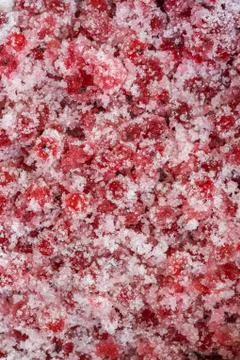 Abstract texture with red currant mixed with sugar Stock Photos