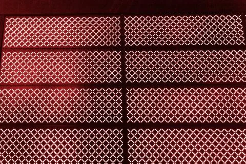 Abstract texture of red luminous blur lamps on a black background Stock Photos