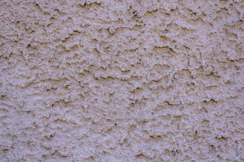 Abstract texture with a rough, rugged surface, light color. Stock Photos