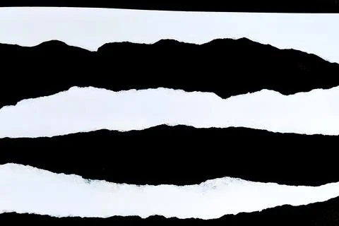 Abstract texture of torn paper with black and white horizontal stripes. Stock Photos