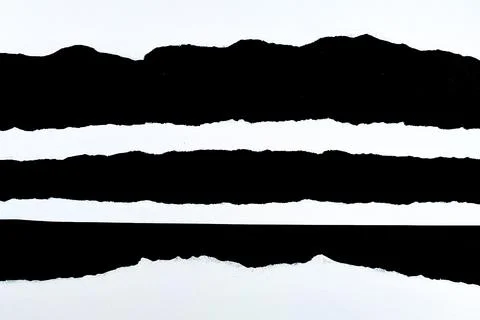 Abstract texture of torn paper with black and white horizontal stripes. Stock Photos