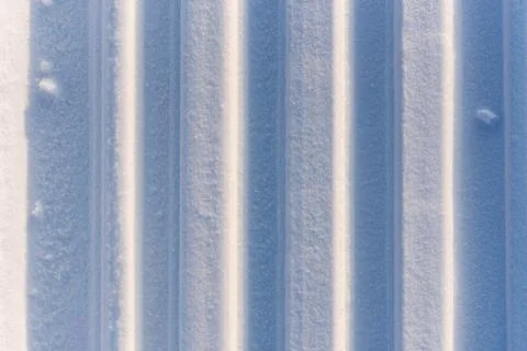 Abstract texture with vertical sled trail on snow Stock Photos