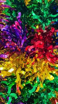 Abstract texture of vibrant multi colored metallic tinsel garland backgroun.. Stock Photos