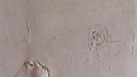 Abstract texture of white paint blistering or bubbling, peeling on the wall. Stock Footage 302806417