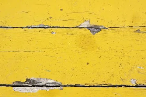 The abstract textured appearance of a yellow, weathered wooden boat. Illustrazione stock