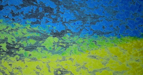 Abstract textured background featuring vibrant blue, green, and yellow hues Stock Footage 319791172