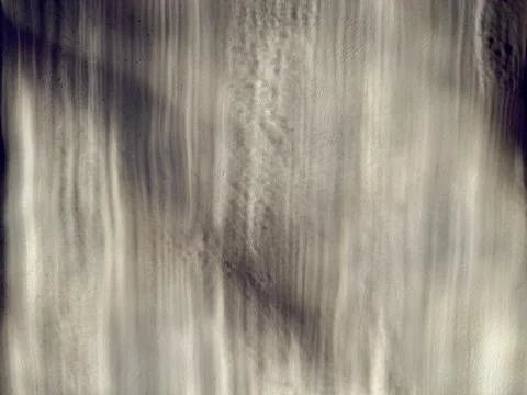 Abstract textured beige wall with vertical shadows and dramatic chiaroscuro l Stock-Fotos