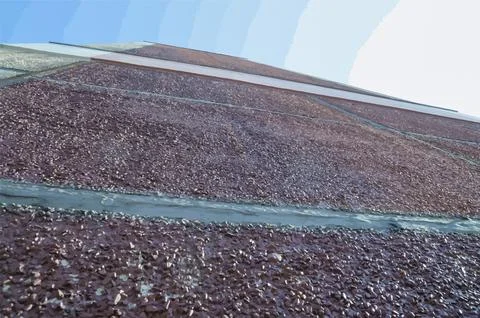 Abstract textured building wall with sky background 스톡 사진