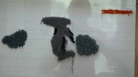 Abstract Textured Fabric Artwork with Gray and Black Shapes Stock Footage 329374941