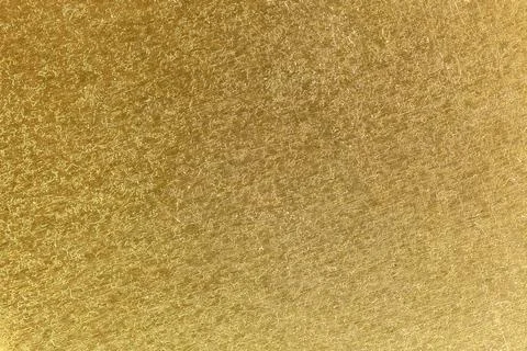 Abstract textured gold surface background Stock Photos