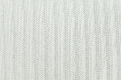 An abstract, textured image in gradient tones of white to light grey with s.. Stock Photos