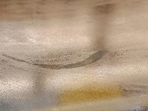 Abstract Textured Metallic Surface with Light Reflection and Curved Detail 스톡 사진