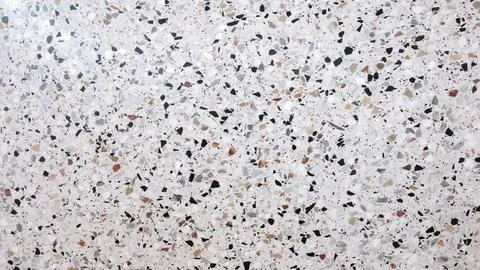 Abstract textured stone background with a pattern of small particles interspe Stock Photos
