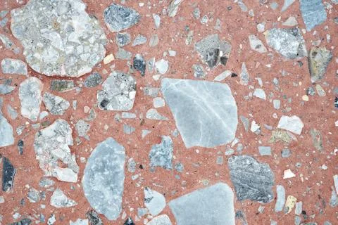 Abstract textured stone background with a pattern of small particles interspe Stock Photos