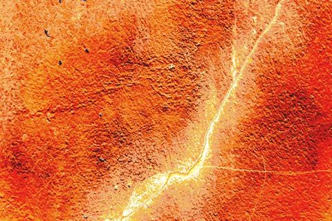 Abstract thin crack on a concrete wall, color change, pastel background Stock Photos