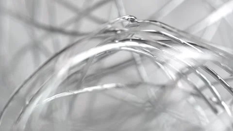 Abstract thin silver wire on gray background. Stock Footage 274054856