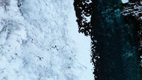 Abstract top-down aerial view of a crystal clear turquoise river flowing through Video stock 326126652