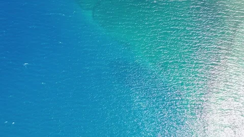 Abstract top-down drone shot rising over blue water gradient in Pangong Lak.. Stock Footage 336331383