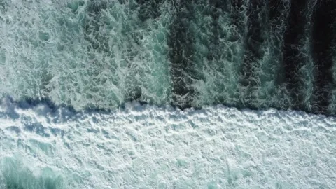 Abstract top down foamy ocean waves Stock Footage 166943756