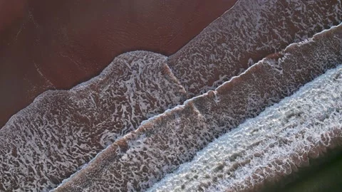 Abstract top down foamy ocean waves breaks beach Stock Footage 220688650