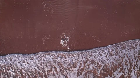 Abstract top down foamy ocean waves breaks beach Stock Footage 220833335