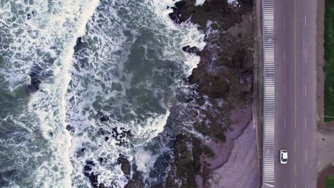 Abstract top down foamy ocean waves crashes rock Stock Footage 220917579