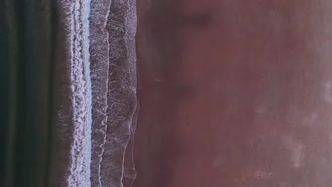 Abstract top down foamy ocean waves breaks beach Stock Footage 222047100