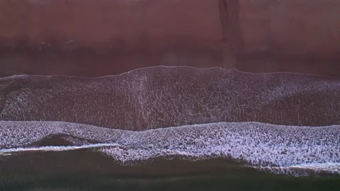 Abstract top down foamy ocean waves breaks beach Stock Footage 224107694