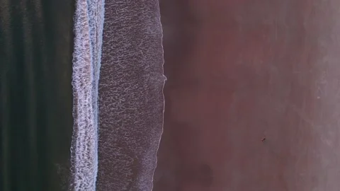 Abstract top down foamy ocean waves breaks beach Stock Footage 224913747