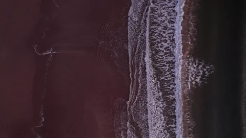 Abstract top down foamy ocean waves breaks beach Stock Footage 255715296