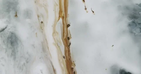 Abstract top shot of paint getting mixed Video stock 137412730