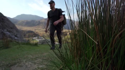 Abstract tracking slider shot of a mountain hiker Stock Footage 209616421
