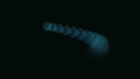 Abstract trail of glowing blue and green circular shapes on black background 库存影片 335149896