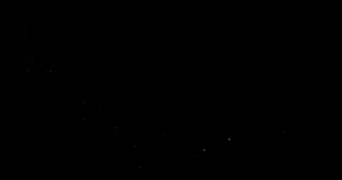 Abstract trails of particles fly along a curved trajectory against a black b Stock Footage 325740278