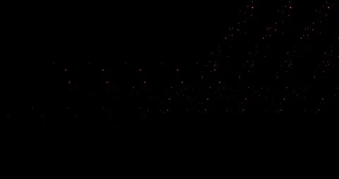 Abstract trails of particles fly along a curved trajectory against a black b Stock Footage 325740286