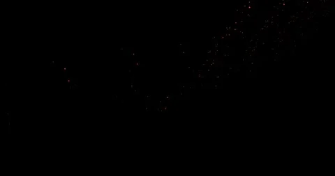 Abstract trails of particles fly along a curved trajectory against a black b Stock Footage 325740297