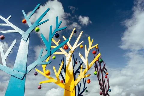 Abstract tree shape on a dark blue sky background with clouds close-up Stock Photos