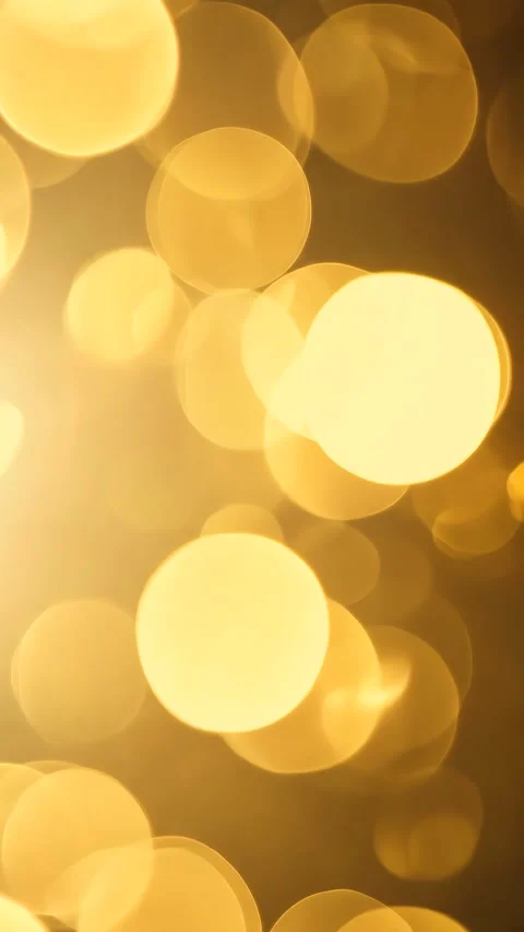 Abstract twinkled bright background with bokeh defocused golden lights. Vertical Stock Footage 310229010