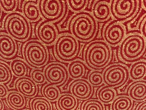 Abstract twirl pattern on a red surface Stock Photos