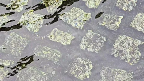 Abstract underwater stone texture with clear rippling water surface Stock Footage 345097489
