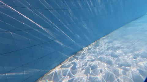 Abstract Underwater Sunlight Patterns on Swimming Pool Bottom Stock Footage 340899145