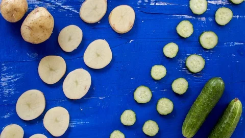 Abstract vegetable on blue wood surface stop motion footage. 4k animation seamle Stock Footage 107192589