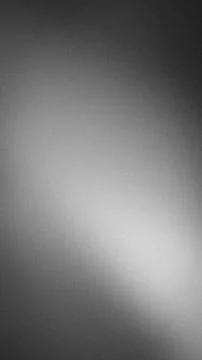 Abstract vertical gradient grainy black white gray background for tech wall.. Stock Photos